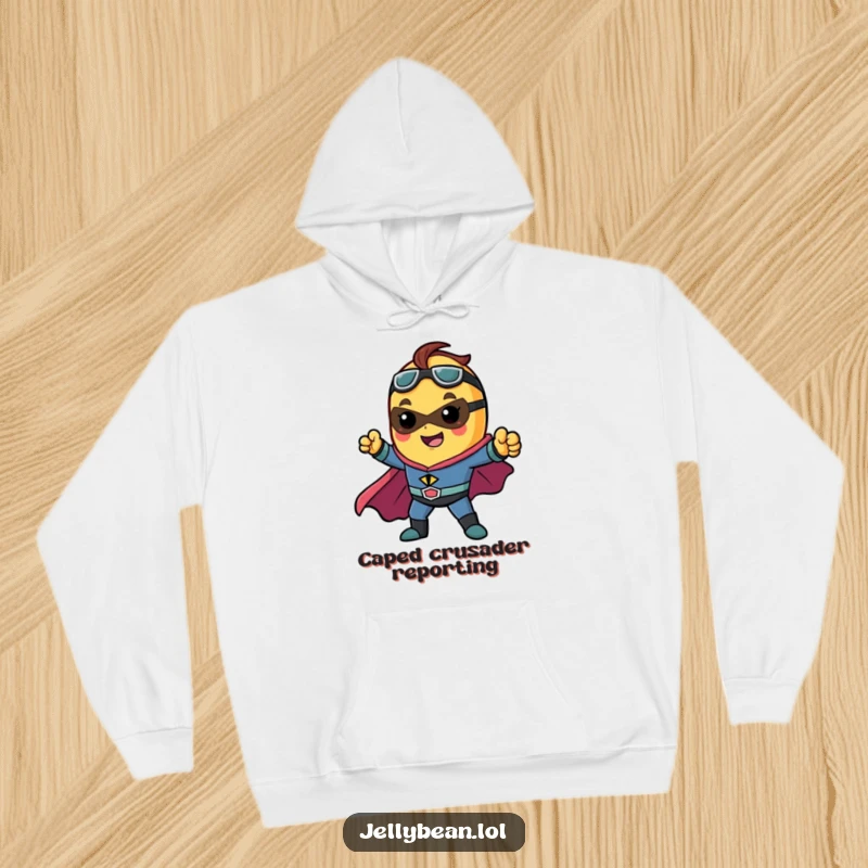 Funny hoodie with a jelly bean character dressed as a superhero, striking an epic pose, ideal for staying warm and heroic.